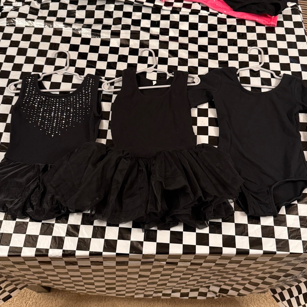 Three dancewear leotard pieces for girls, all black, size 110.
